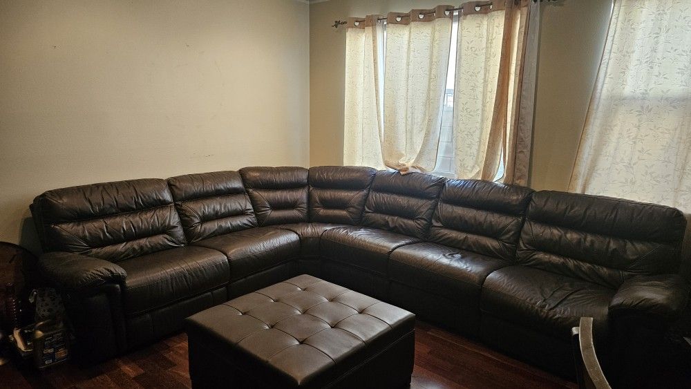 brown leather couch with storage ottoman
