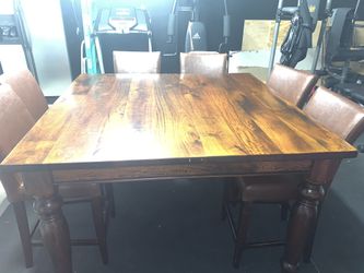 Heavy solid wood table w/ 6 chairs