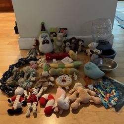 LOTS OF DOG TOYS ALOT OF THEM NEW CONDITION