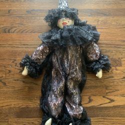 Porcelain clown doll with black lace clothing 