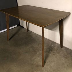 Coaster mid-century modern table with clean tapered legs and walnut finish