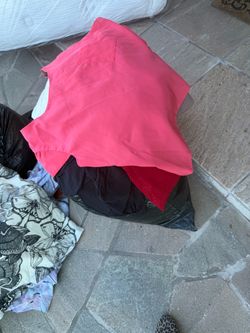 2 plastic bags with used clothes pick today