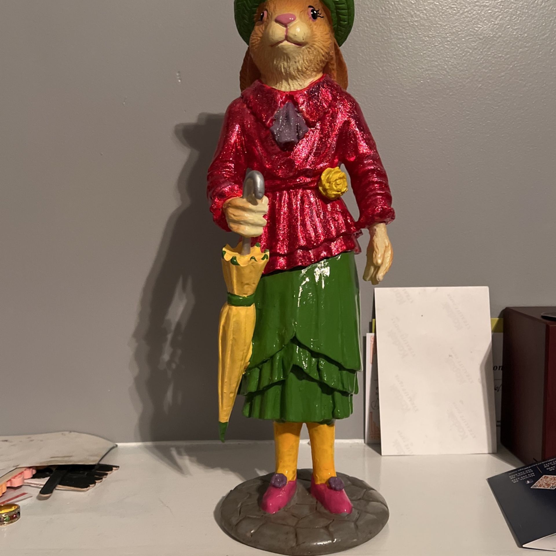 Ms. Rabbit holding a umbrella