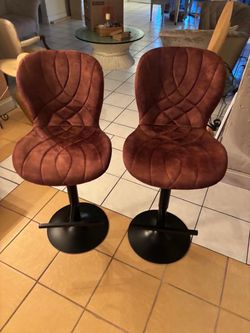 Two velvet barstools.. swirl and go up and down.. $70 for both
