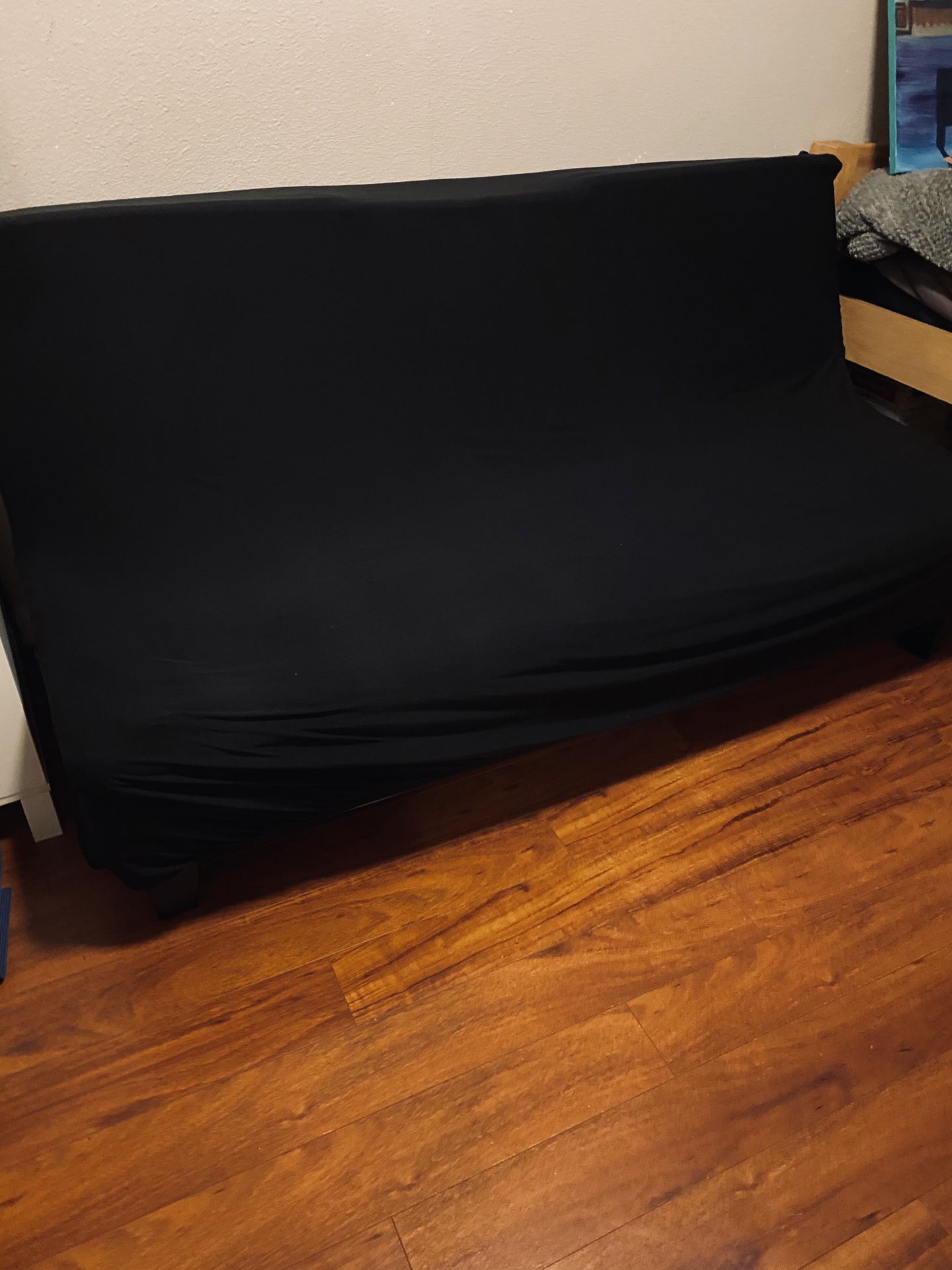 Black futon (faux leather underneath) w couch cover