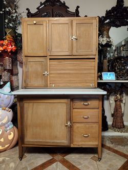 Kitchen cabinet with an antique mill