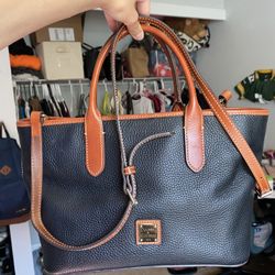 Dooney & Bourke Pebble Grain Brielle satchel purse hand bag with brown leather trim. Bright red interior