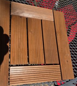 Interlocking wooden tiles perfect for patios and walkways