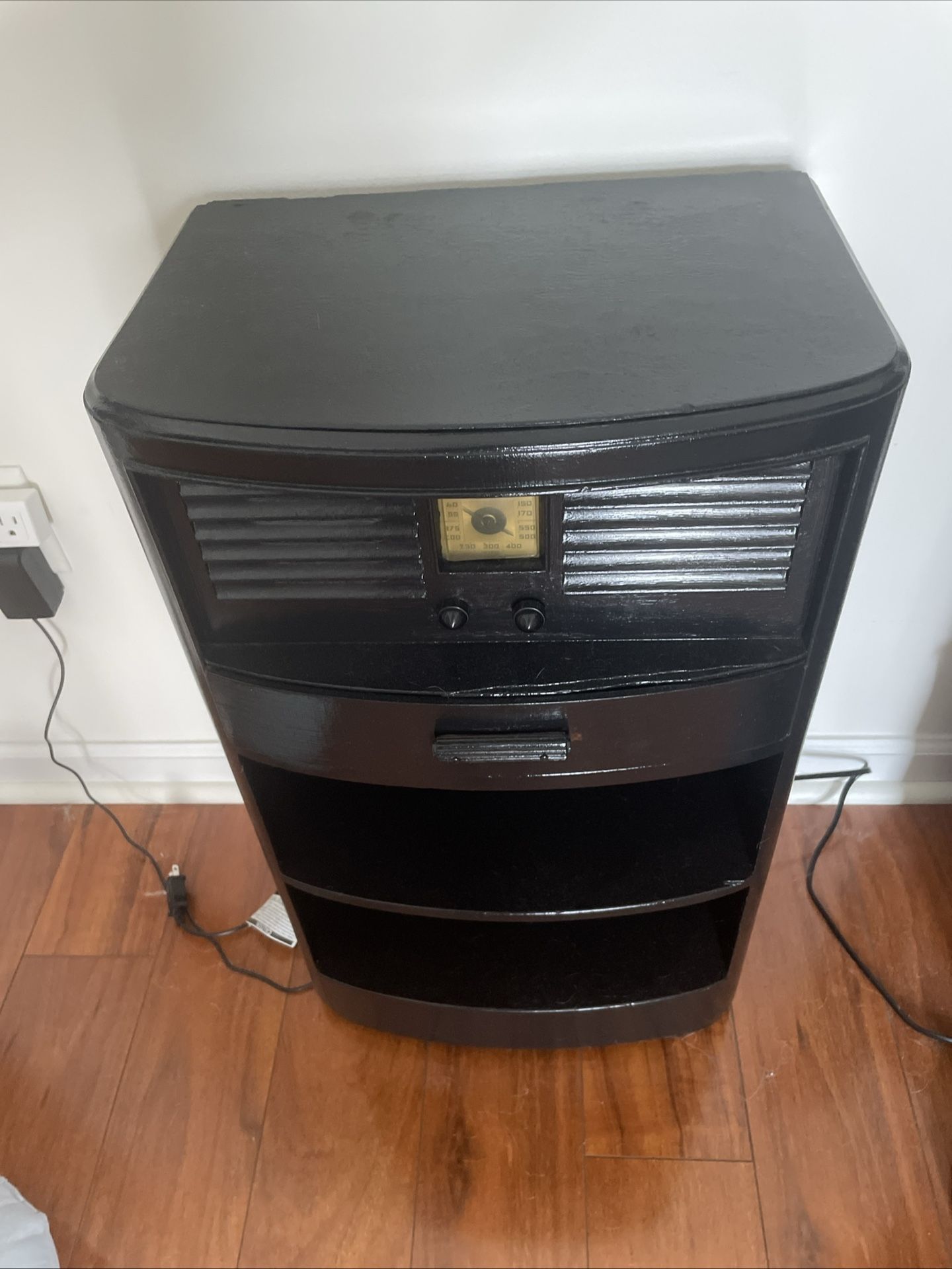 1940s nightstand tube radio with all its original hardware intact. It stands approximately 27 inches tall and measures around 16 x 11 inches in width