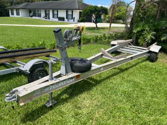 Aluminum dual torsion axel trailer up to 24’ boat. Registration. New winch, . Ready to load…