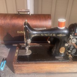 1926 Singer With A Bentwood Carry Case. It has been serviced and is working great.