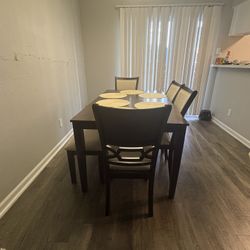 four chairs and a bench