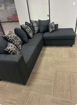 Brand new black sofa with pillows