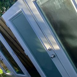 2 Sets of vinyl double doors with inner blinds non-impact sold separately approximately 35x35x76.75