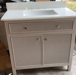 Bathroom Vanity with White Stone Top and Sink