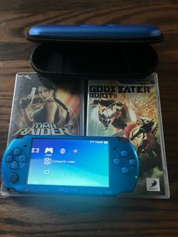 Blue PSP with two games and charger