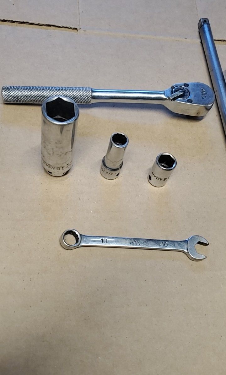 Mac Tools , 3/8 " Ratchet , 18mm ,3/8 and ,12mm Sockets ,and 10mm Wr.Snap-On Tools , 3/8 Long Extention ,Screw Driver and 17mm 6 Point Long Socket