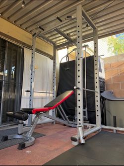 Squat rack cage and weight bench