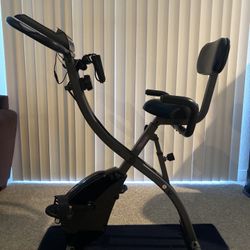 Slim Cycle stationary bike with built in resistance bands 
