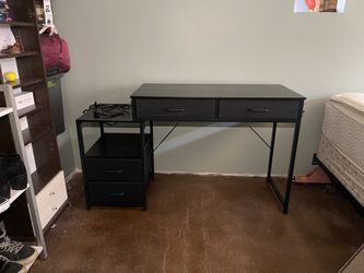 desk with drawers and power strip