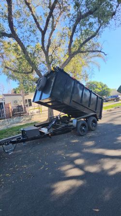 BRAND NEW DESIGN DUMP TRAILER 12x8x4 12,000 LBS ROLLING TARP AND SPARE TIRE HYDRAULIC SYSTEM ELECTRIC BRAKES TITLE IN HAND FOR ANY QUESTION TEXT ME PL