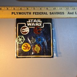 Disney Star Wars 7 Pin Booster Pack featuring retired emblems