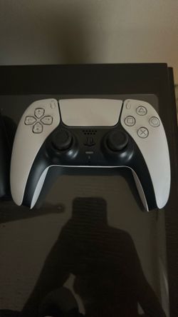 2 PlayStation 5 controllers with charging stand