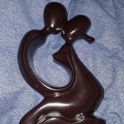 Abstract Sculpture of a man and woman kissing