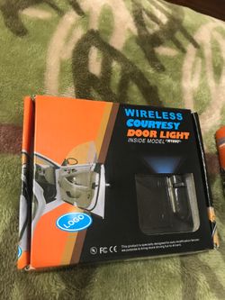 Pair of wireless courtesy Cadillac logo door light projector