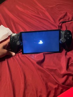 Sony PlayStation Portal Remote Player ( comes with a free charger)