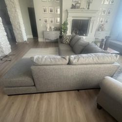 Luxury Dark Gray Sectional Sofa with Matching Ottoman – Clean, Sharp & Ready for Delivery