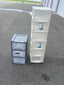 3 storage totes one with wheels. The gray one was used inside and is fairly clean. The clear stackable one was garage used and has some dust and will 