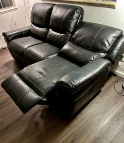 Leather power reclining sofa