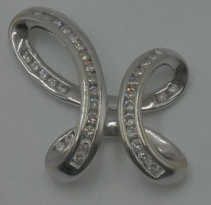 14kt white gold slide cross pendant with 0.50 carat of round diamonds 3.6 grams. pre owned. very good condition. 836527-2.