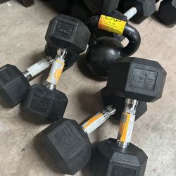 new pair of 25lb and 30lb rubber dumbbells with one 35lb kettlebell 