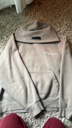 Cream brown essentials hoodie! size small! has a small oil stain