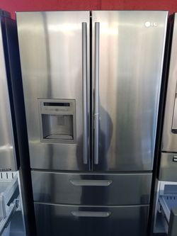 Beautiful LG 4 door fridge stainless steel 1 year warranty