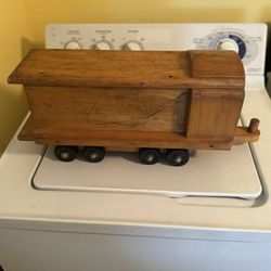 Vintage wooden train car on wheels 