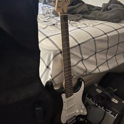 Electric Guitar With Mini-amp And Headphones