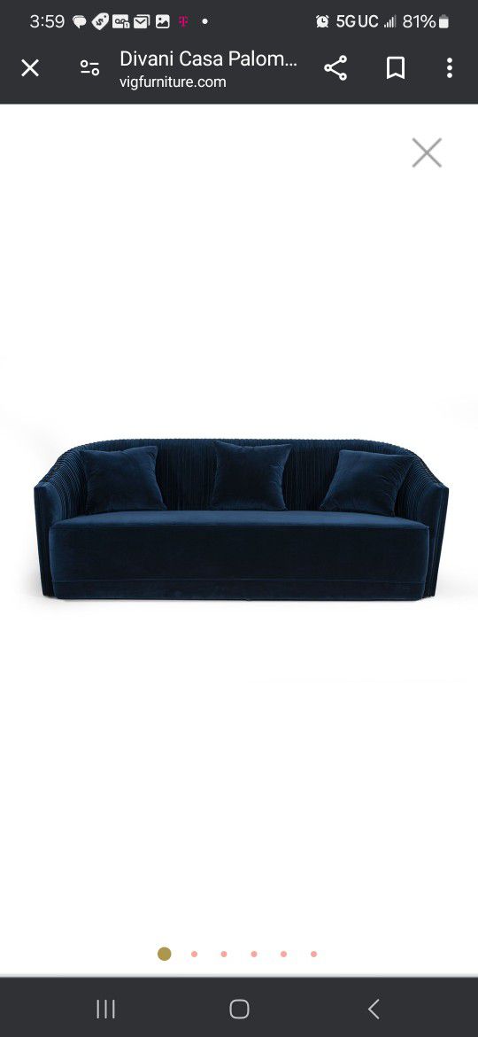 Modern Blue Velvet & Brass Sofa exudes elegance and comfort. Upholstered in luxurious blue velvet, it features exquisite antique brass nailhead trim t