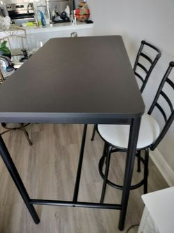 Bar height table with 2 stools