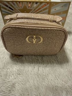 Christian Dior gold makeup bag