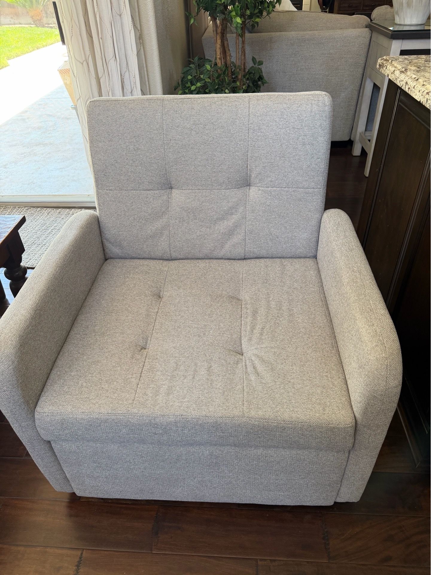 New beige accent chair with pull out foot stool and charging ports
