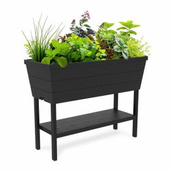 Planter with water float and self watering