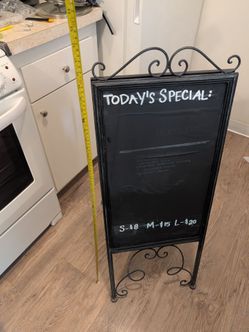 Iron bistro sign with chalk board