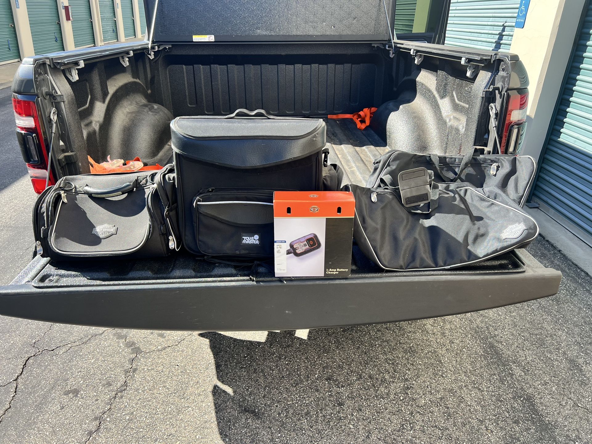 Motorcycle Bag, Charger, And Floor Jack 