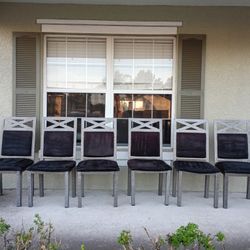 Seven Black Metal Chairs