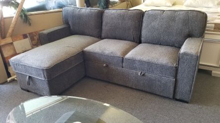 Brand new gray chenille 92" x 61" reversible sectional with sofa sleeper and storage chaise