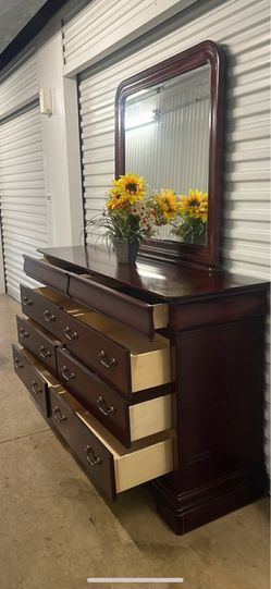 Delivery available . Real wood long dresser with big drawers, big mirror. Drawers sliding smoothly