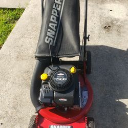 Snapper rear wheel drive lawn mower. Starts and runs great. Made in USA.